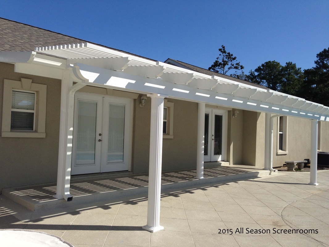 White pergola attached to an insulated top.